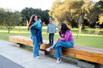 Latin Family enjoy leisure time together in a scenic park setting