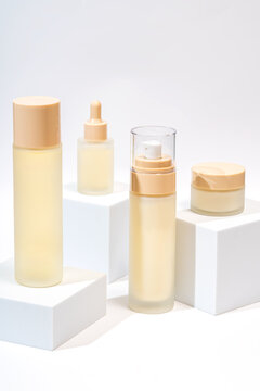 Elegant cosmetic packaging on white background