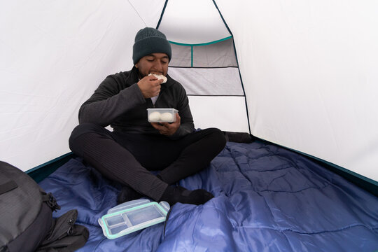 Camper Enjoys a Meal Inside a Tent at La Malinche, Mexico