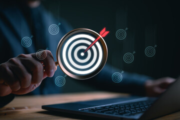 Targeting business concept. Businessman finding virtual target icons for business objective....