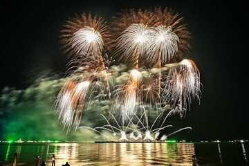 Beautiful fireworks set off in the middle of the sea.