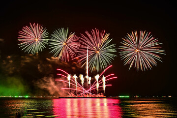 Beautiful fireworks set off in the middle of the sea.