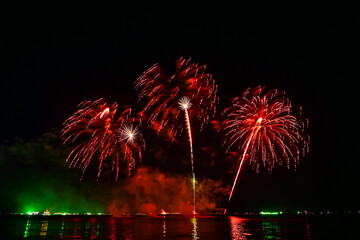 Beautiful fireworks set off in the middle of the sea.