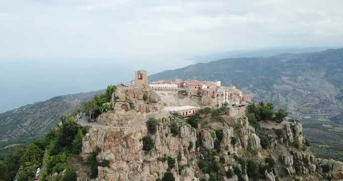Aerial view, drone flight over Pollina, beautiful town on top of the mountain in Sicily, Italy