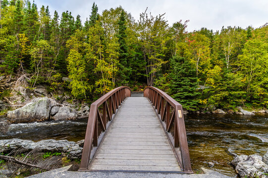 A view across a footbridge over the Corner Brook Stream at Corner Brook in Newfoundland, Canada in the fall
