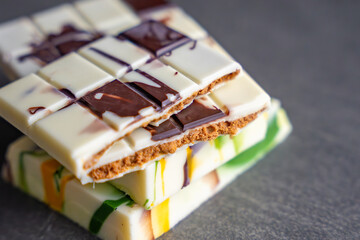 Piece of trend Dubai white chocolate with halva paste. Confectionery handmade sweets at home in the kitchen. 