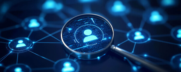 Magnifying glass focusing on a user profile icon, representing talent search, recruitment, and personal data analytics in a digital network