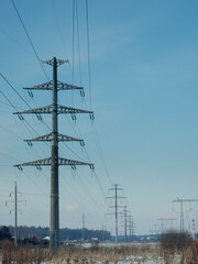 Overhead Power Lines Against Blue Sky Background