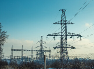 Overhead Power Lines Against Blue Sky Background