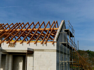 Extension of a family house, cubic shape modern with a flat roof and large windows and a terrace. wooden frame on which will be insulation and cladding. ecological renewable houses