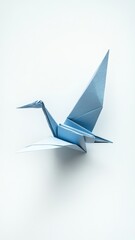 Naklejka premium Blue Origami Crane in Flight 