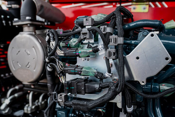 Obraz premium Construction machinery engine close up with pipes and valves