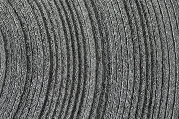 Synthetic packaging foil rolled budle waves, soft focus close up