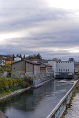 Scenic view of Limmat river with autumn trees on an autumn day at Swiss City of Zürich. Photo taken November 18th, 2024, Zurich, Switzerland.