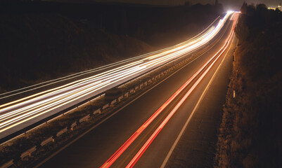 Highway car light trails at night.