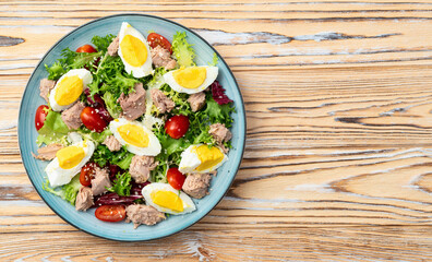 Canned Tuna salad with eggs and tomatoes photography . Top view