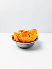 Cassava crackers or cassava crackers, with an additional coating of spicy powder. Isolated white background