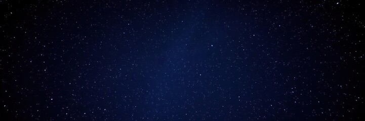 Fototapeta premium An enchanting starry night scene with numerous stars shining brightly against a backdrop of deep indigo and purple hues, cosmos, magical