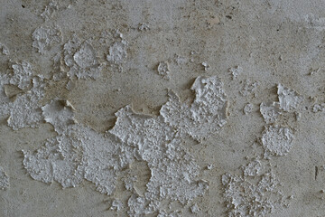 Peeled paint on old wall, weathered paint in abandoned building close up