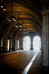 Fototapeta premium Light tunnel through an old building on the streets of Amsterdam