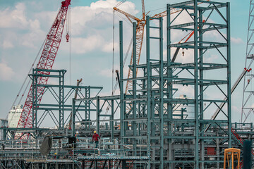 Worker male assembly in progress new construction inspection scaffolding