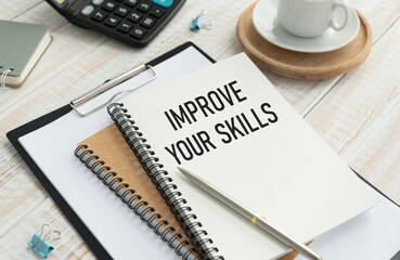 Selective focus.Text IMPROVE YOUR SKILLS with blur pencil and blur glasses on white background.