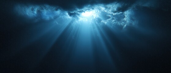 Fototapeta premium A blue sky with a bright light shining through the clouds