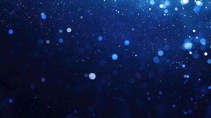 Blurred blue bokeh lights shimmering against a dark backdrop, creating a festive atmosphere with spacious areas for text and graphic overlays.