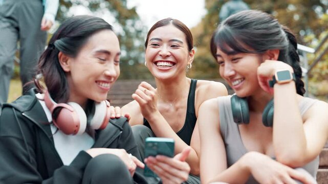 Exercise, phone and steps with Japanese women outdoor together for cardio, training or workout. Break, fitness and smile of athlete friends on stairs for communication, tracking or update with app
