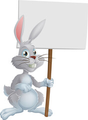 Obraz premium White Easter bunny holding sign