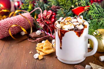 Mug with S`mores hot chocolate or coffee, thick smores hot cocoa or latte drink with toasted marshmallow, graham cracker and chocolate topping