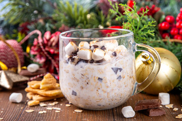 Overnight s`mores oatmeal, Christmas, winter holiday tasty breakfast healthy idea with oats, yogurt, marshmallow, chocolate and creamy sauce