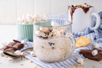 Overnight s`mores oatmeal, Christmas, winter holiday tasty breakfast healthy idea with oats, yogurt, marshmallow, chocolate and creamy sauce