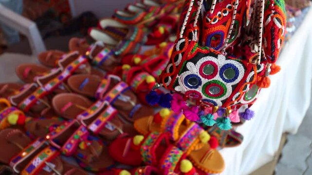 Traditional and colorful Footwears and hand bags of Kutchi Art. Placed in a Store at Rann Utsav in Great Rann of Kutch. Gujarat India.