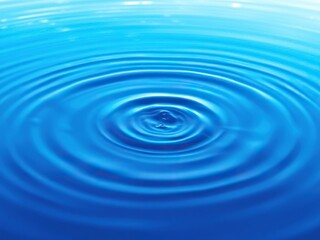 Water ripple effects on a bright and vibrant abstract blue background, bright blue, natural beauty