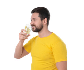 Fototapeta premium Happy man drinking water with lemon on white background