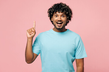 Young insighted smart proactive Indian man he wearing blue t-shirt casual clothes holding index...