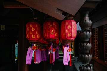 Red lanterns with Chinese characters in the Jade Buddha Temple in Shanghai, China © Felix Morion