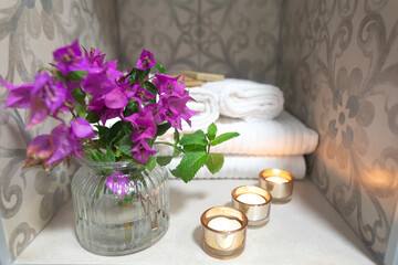 This stunning floral display showcases elegant rings on a beautifully designed table, ideal for weddings or engagements, highlighting romance and creating an enchanting atmosphere