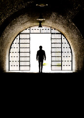 silhouette of a person in a tunnel