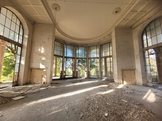 02.12.2023, Tskaltubo, Georgia, a former canteen during the Soviet era in a sanatorium, a balneological resort, stained glass windows, stripped parquet, shabby walls, stucco on the ceiling, wood growi