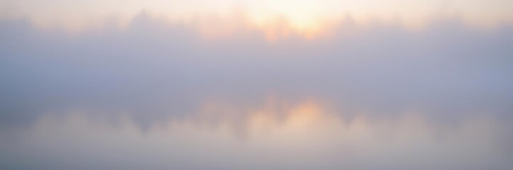A misty veil hangs over a body of still water at dawn, gentle ripples, natural hues, subtle color palette