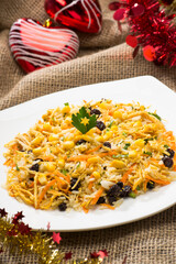 Brazilian christmas food, Greek-Style Rice ( Arroz à grega ) rice with raisins,carrots, peas and potato sticks.