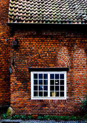 old brick wall with windows