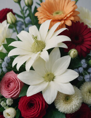 Close-up of a vibrant floral arrangement featuring daisies, gerberas, and roses