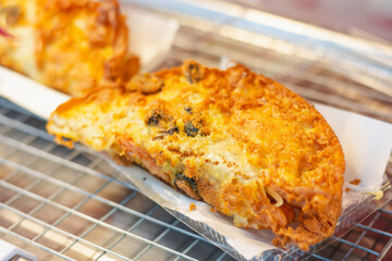Close-up of fried oysters in a pan
