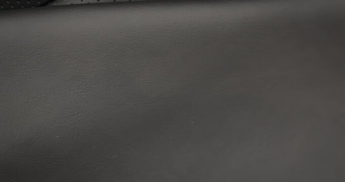Wrinkles of natural leather. Check quality and testing of natural soft leather, material for craft and hobbies accessories, macro.