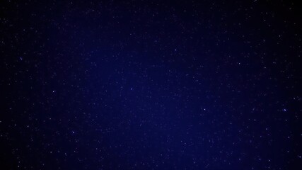 Fototapeta premium A starry night sky with vibrant hues of indigo and violet, a sprinkling of sparkling stars against the inky blackness, twinkling lights, astronomy, stars