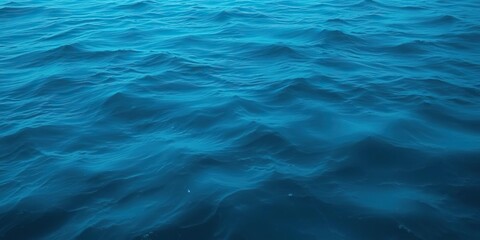 Fototapeta premium A vast ocean surface with undulating waves in a deep blue tone, resembling an otherworldly mist, wave, deep blue