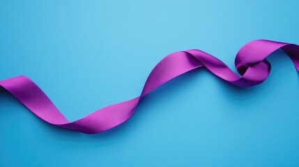 A beautifully knotted purple ribbon elegantly twisted against a vibrant blue background, showcasing smooth texture and vivid colors.